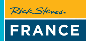 Il logo Rick Steves con il testo &quot;Francia&quot;, su uno sfondo blu e giallo, che riflette la destinazione turistica.